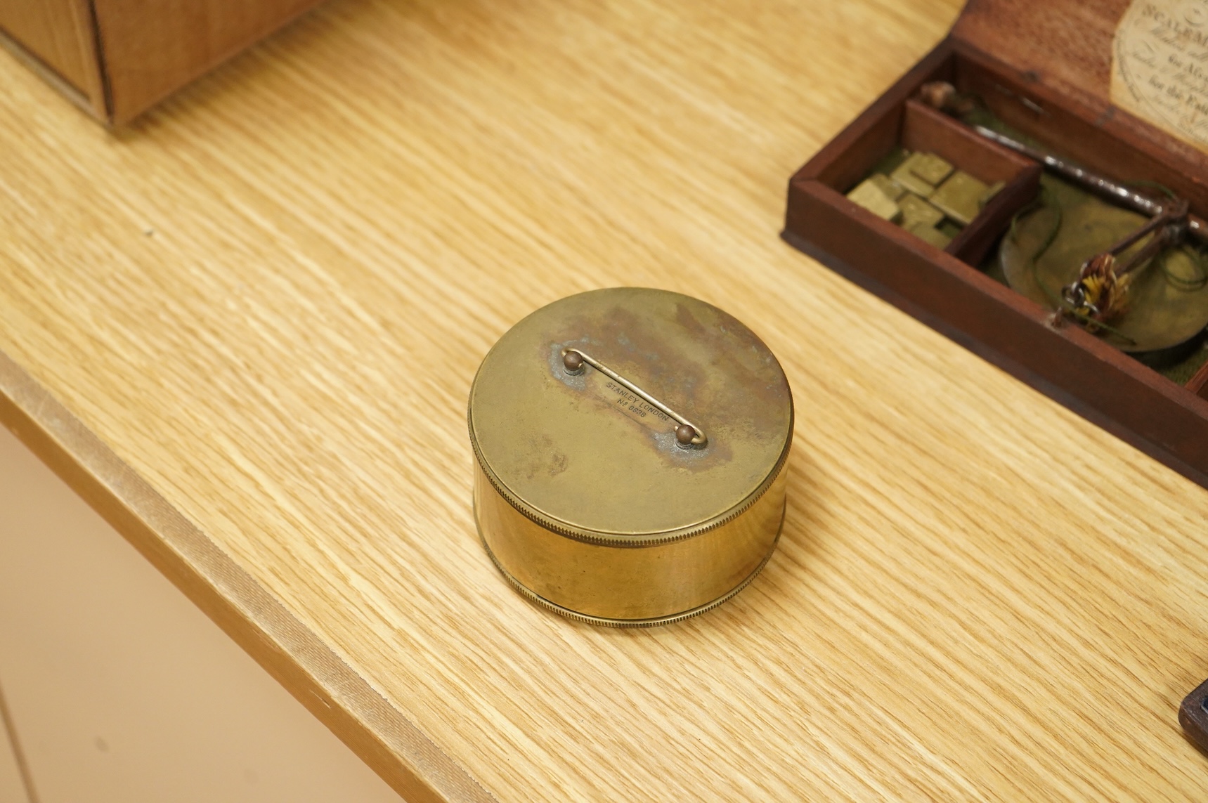 Four scientific instruments, consisting; a set of apothecaries steel balance scales, by Charles de Grave, 59, St. Martin’s le Grand…London; a set of three small drawing compasses, leather cased; a prismatic compass, by S